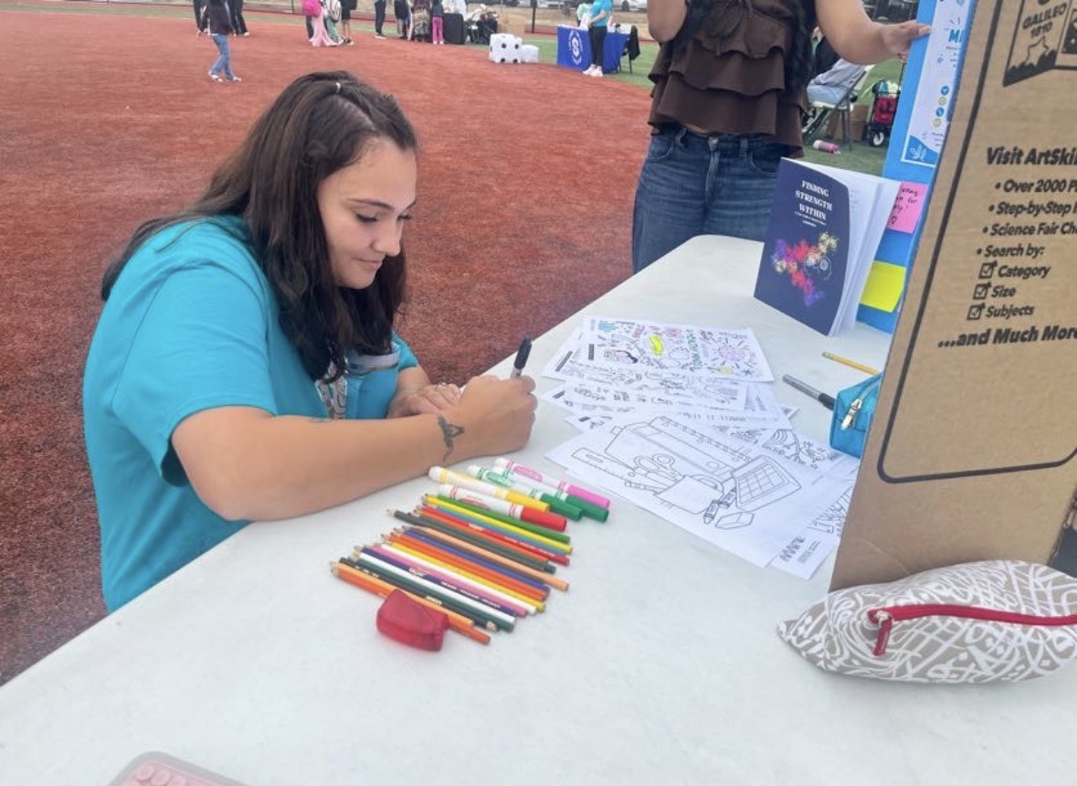 Coloring a back-to-school page at our table